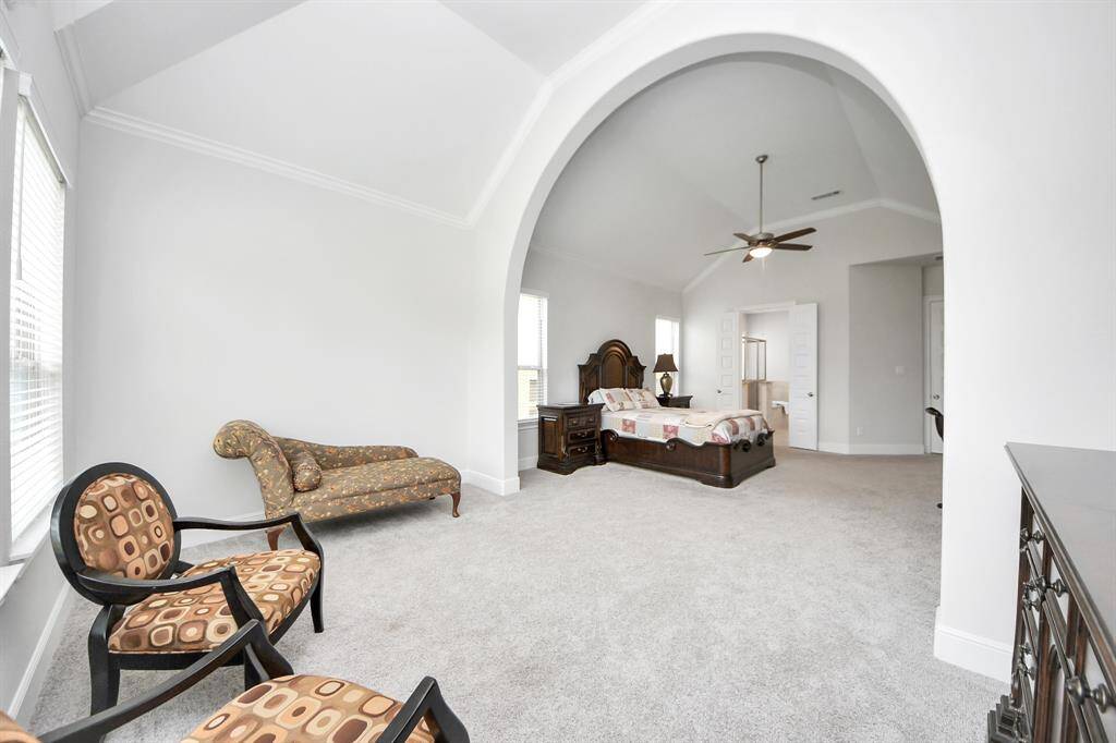 Large sitting area with the primary bedroom