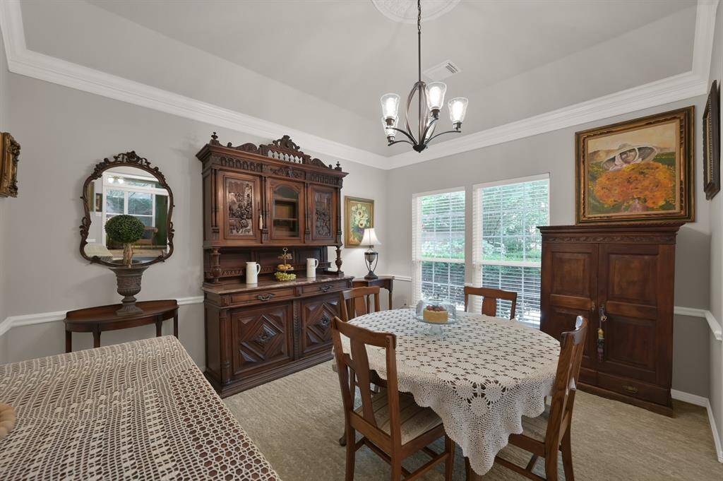 Formal dining is quite large as you can see from all the large antique pieces displayed here