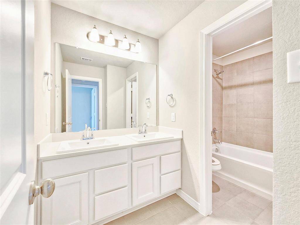 The upstairs secondary bath is the perfect place for multiple people to get ready in the morning. With dual sinks and a separate tub/shower area there will be no more fighting in the morning