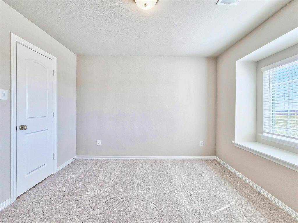 One of the secondary bedrooms with a picturesque window seat