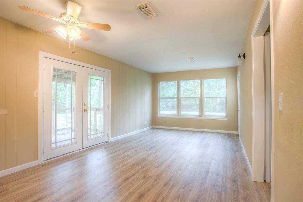 Living room facing side double doors.