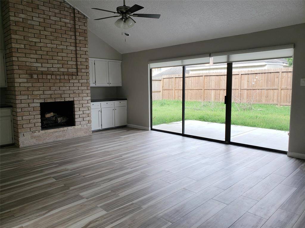 FAMILY ROOM WITH BACK YARD VIEW