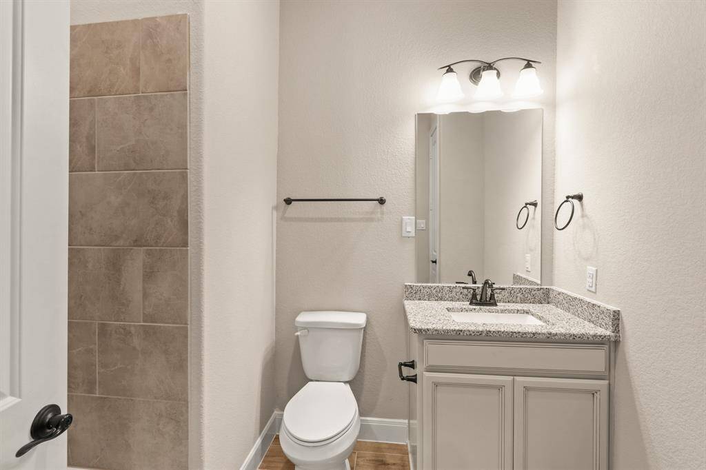 The secondary bathroom is stylishly appointed and thoughtfully designed for comfort and convenience.