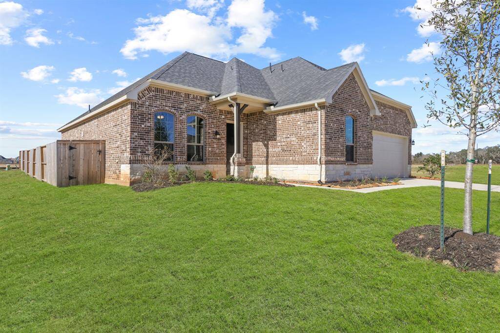 The stone and brick exterior exudes charm and elegance, creating exceptional street appeal that captivates at first glance.