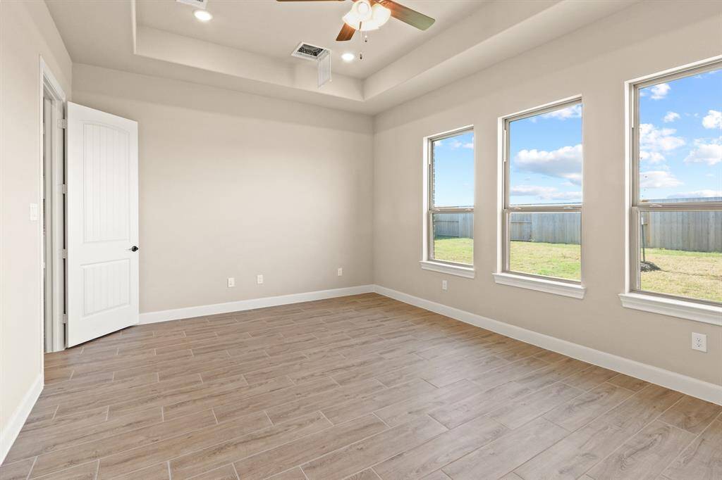 How perfect is this primary suite? Spacious and filled with natural light, this serene retreat offers the ultimate escape, promising comfort, tranquility, and pure relaxation.