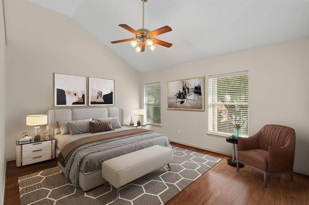 Retreat to this spacious and light-filled primary bedroom, boasting a high ceiling that enhances its airy feel. An elegant archway seamlessly connects to the private bathroom and a large walk-in closet, creating a true owner's oasis.