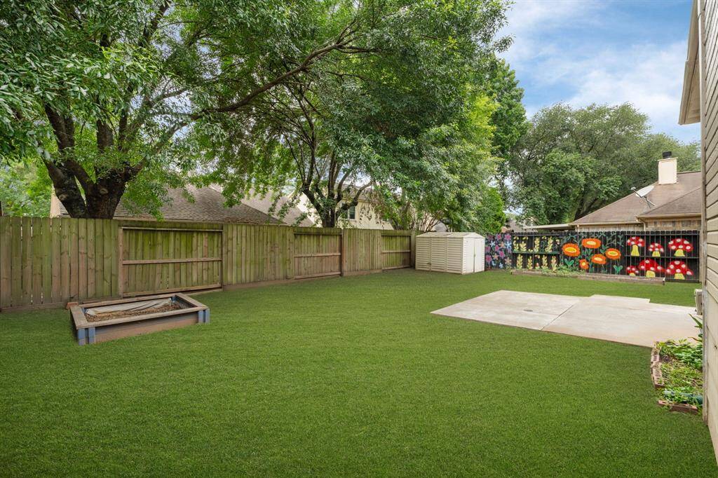 This expansive backyard, visualized with vibrant green, is a true outdoor canvas! Complete with two miniature gardens (one with growing tomatoes!), it's perfectly set up for gardening enthusiasts and promises abundant space for family fun and outdoor entertaining.