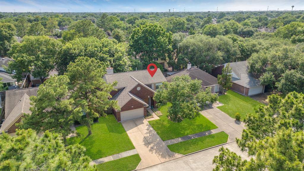 A bird's-eye view of your new home, nestled perfectly within this charming neighborhood.