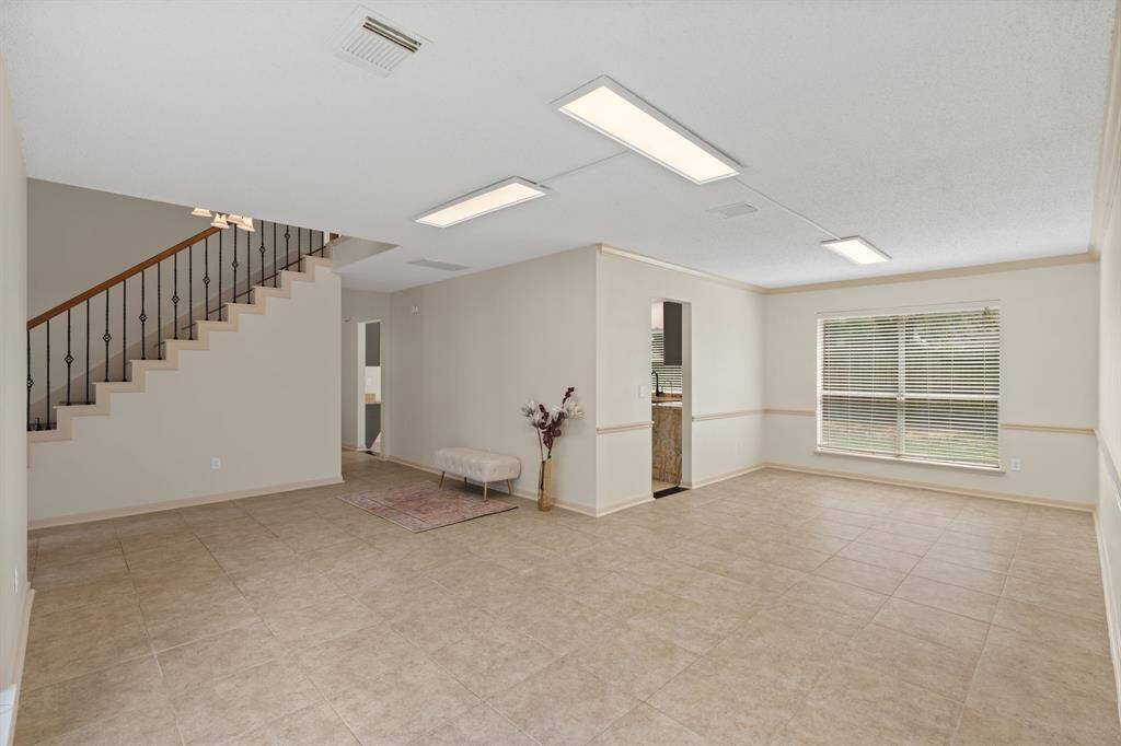 Freshly painted and full of potential! Explore the open living and dining area with its updated wall color.