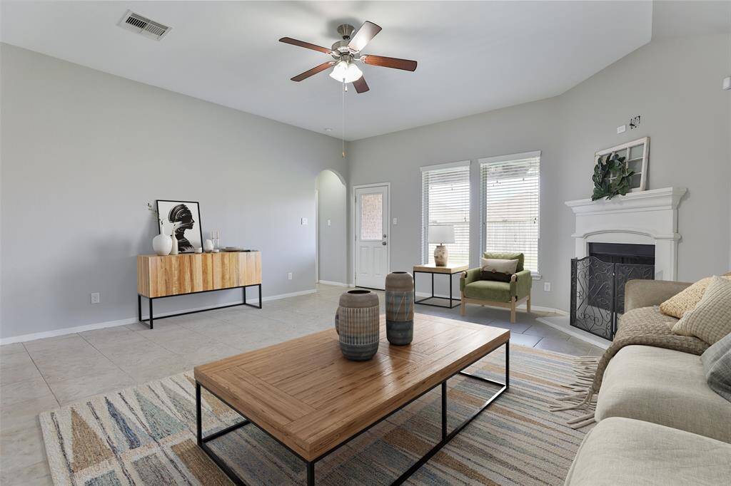 Living is open to kitchen, offers great lighting and cozy fireplace with gas logs.