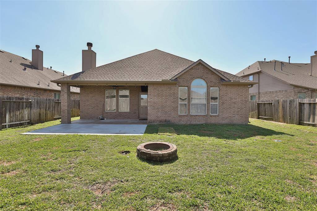 Enjoy grilling or watching the big game on this extended patio with fixed TV.