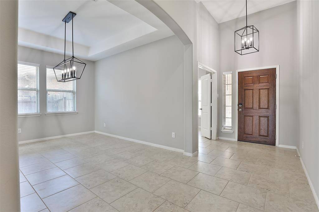 You're instantly greeted with high ceilings and curved archways with an inviting feel.