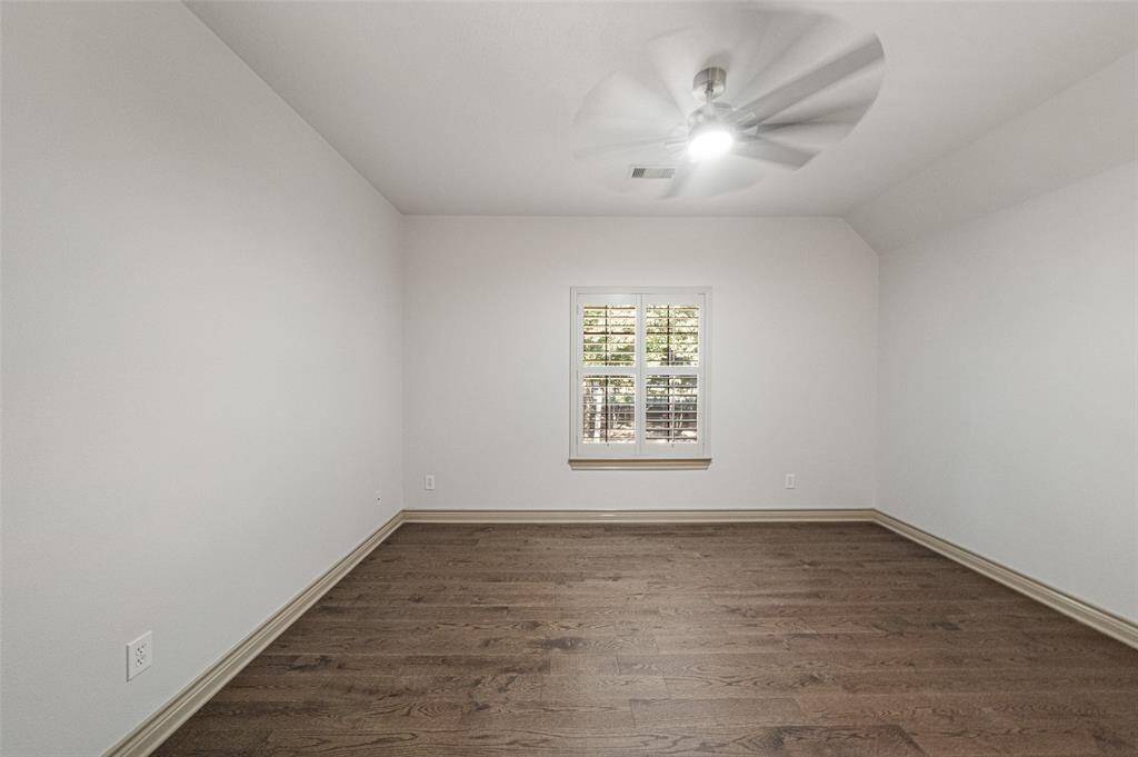 17X11 BEDROOM TWO  Beautiful hardwood floors. No carpet in the entire home. Shares the jack-n-jill bath with separate sink vanity areas and a shared water closet with tub/shower. New 8 blade fan with integrated LED light.