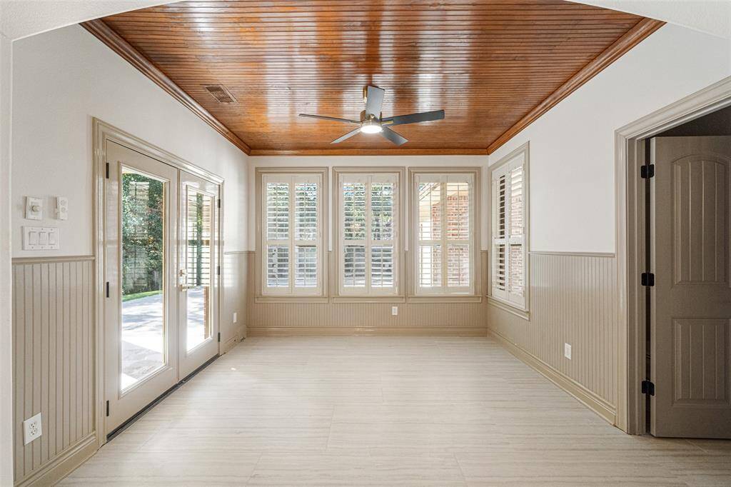 SUNROOM Beautiful Large Form Tile flows through the main living areas & baths. Goes out to the Covered Patio & offers access to the half bath.