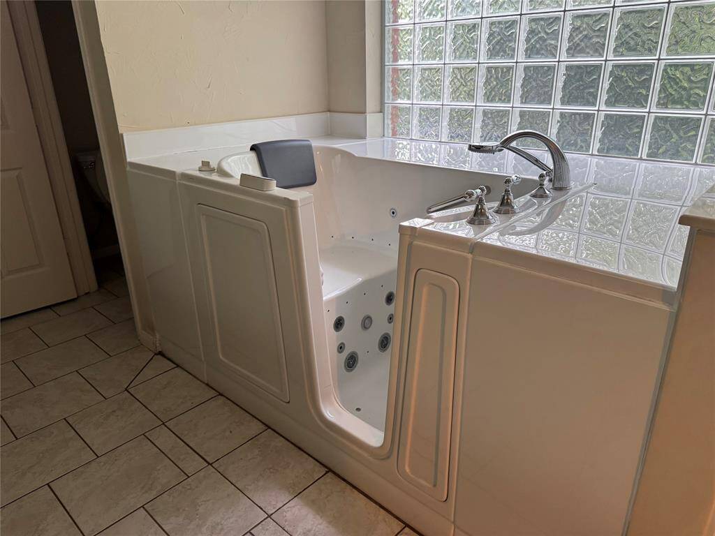 Walk-in tub in the Primary Bathroom