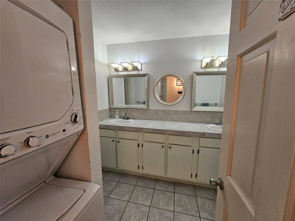 Washer and dryer greet you in the bathroom