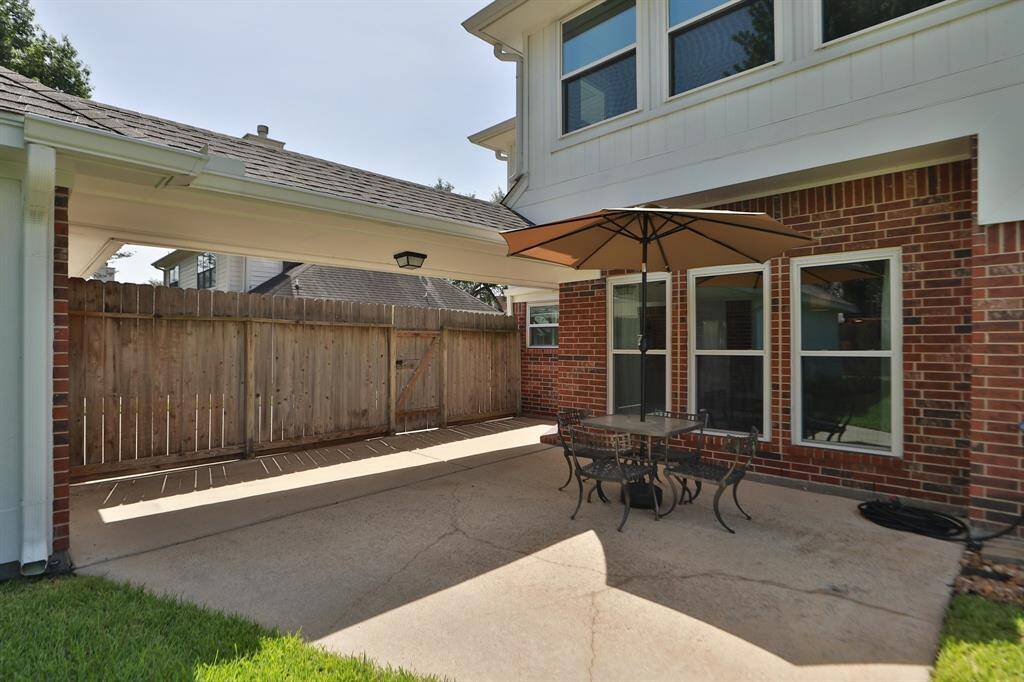 Patio area in fenced backyard