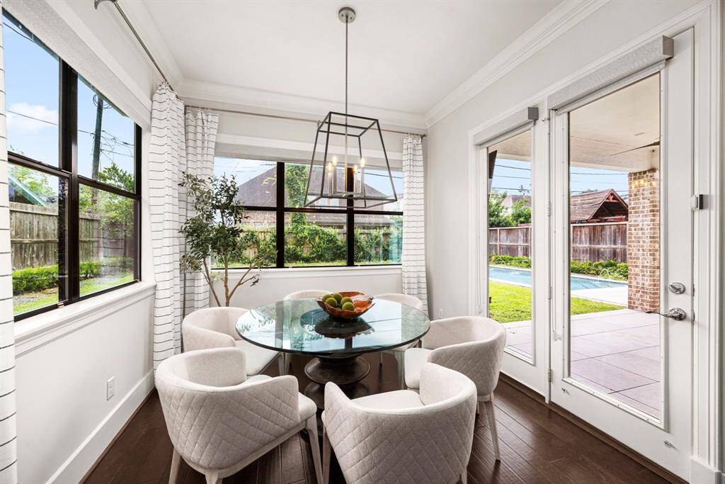 Surrounded with windows, yet private. This dining room offers easy access to patio for grill or outdoor dining.