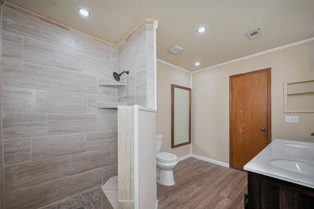 Updated walk-in shower in primary bathroom