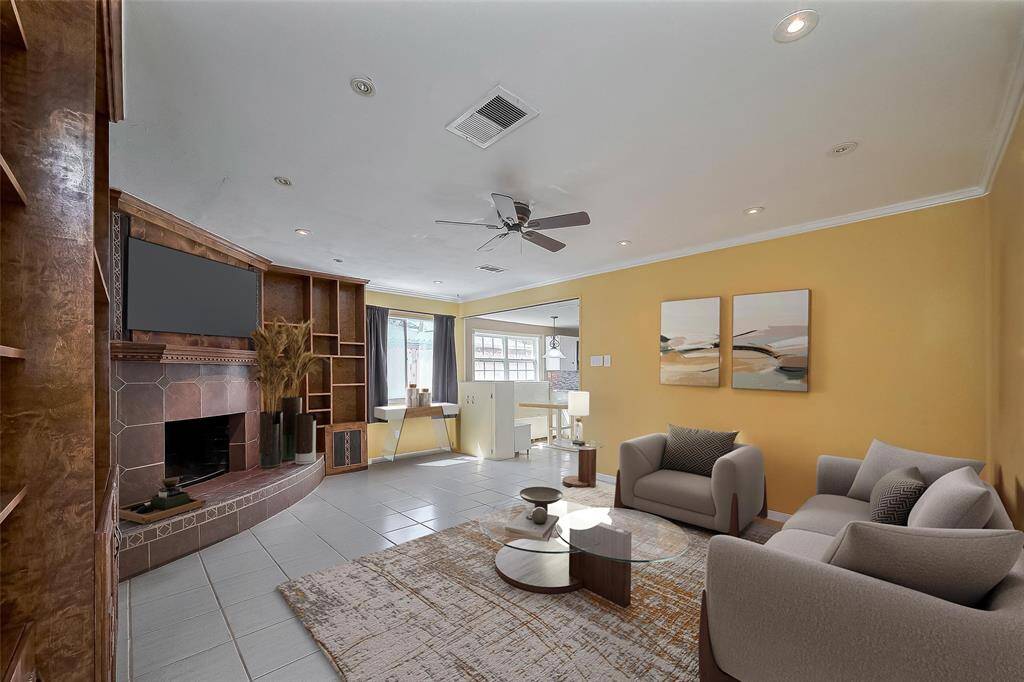 Family Room with fireplace. This photo has been virtually staged.