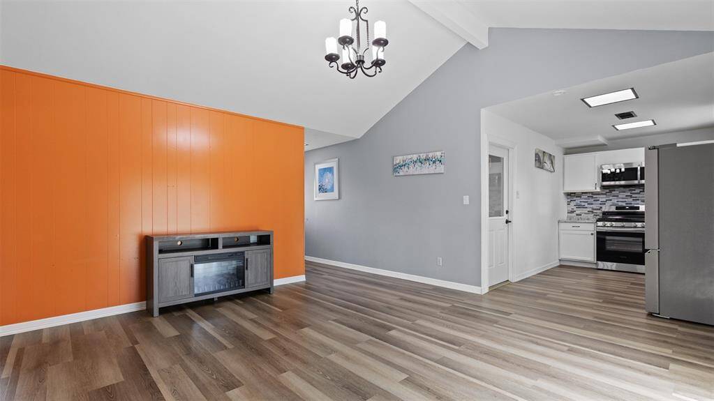 Family Room Looking at Kitchen and Front of Home.