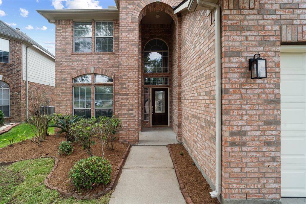 Beautifully Landscaped Covered Entry Area