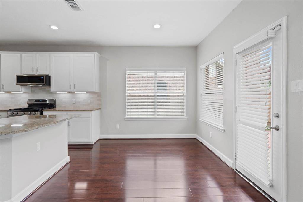 Breakfast Area with lots of natural light and view into the covered patio