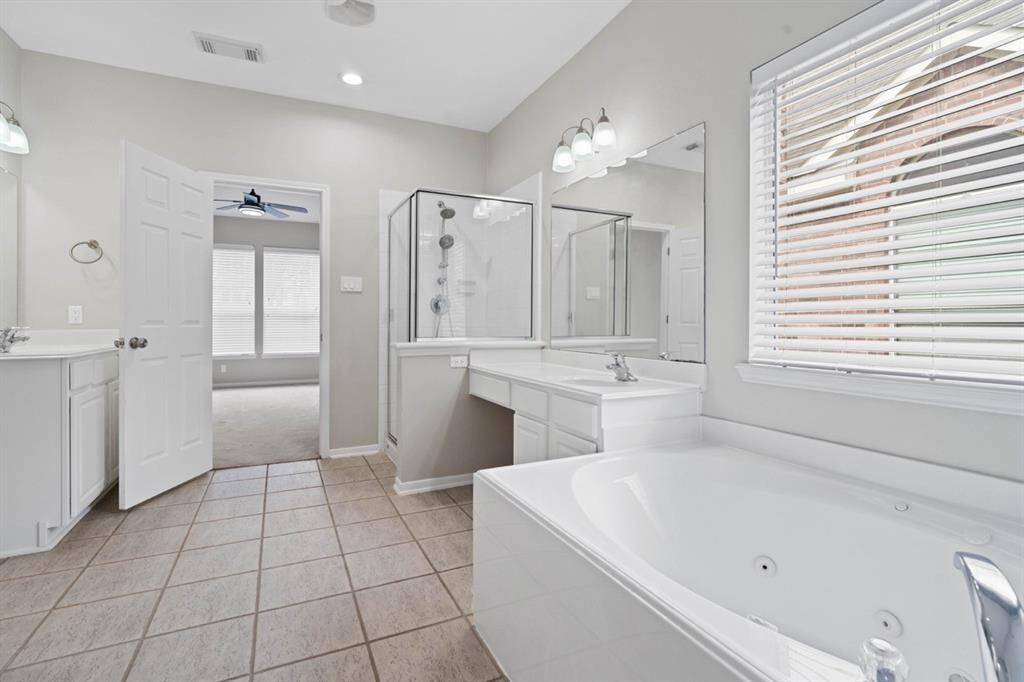 Master Bath with separate shower and a jetted bathtub