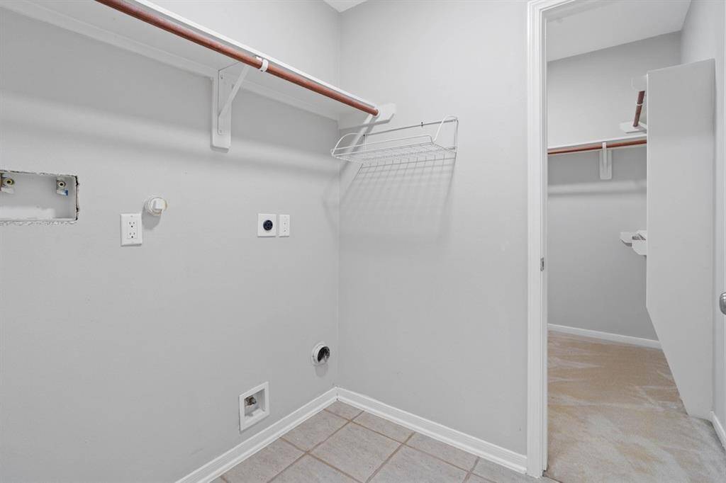 One closet from the Master Suite opens into the laundry room.