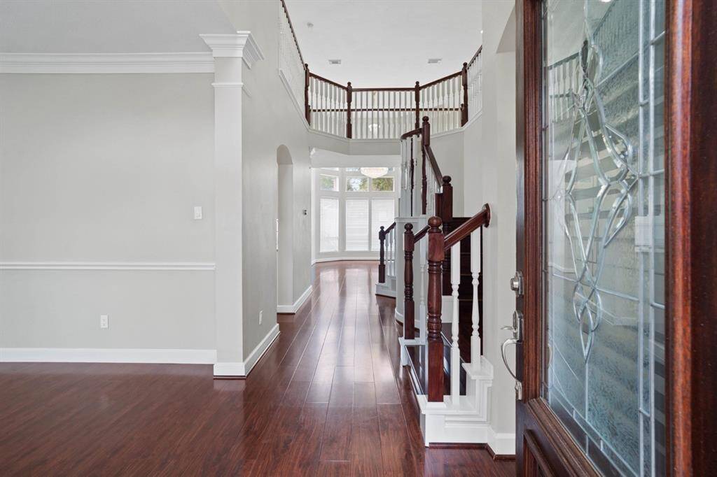 Entry with High Ceilings and Beautiful Staircase