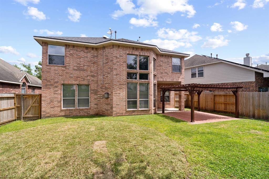 Large Backyard with lots of covered space for entertaining