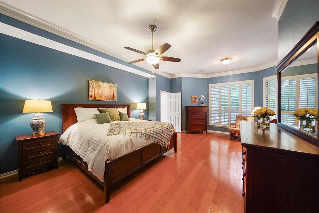 This oversized primary retreat sits at the back of the home overlooking the pool, with a back door to enjoy the back yard too. Enjoy the extra sitting area.