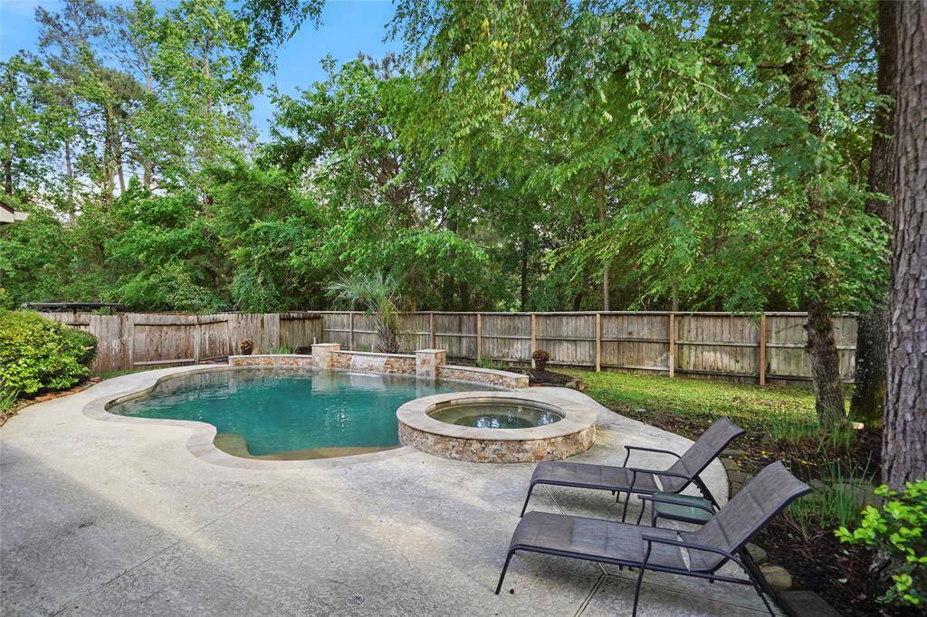 This fabulous 4 bedroom, 3 1/2 bath home has a heated pool/spa in a private back yard!