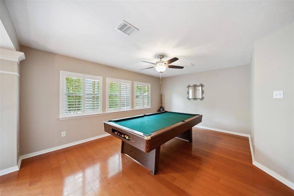 The game room comes complete with a pool table.