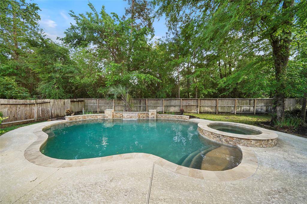 Beautiful heated pool and spa with waterfall feature.