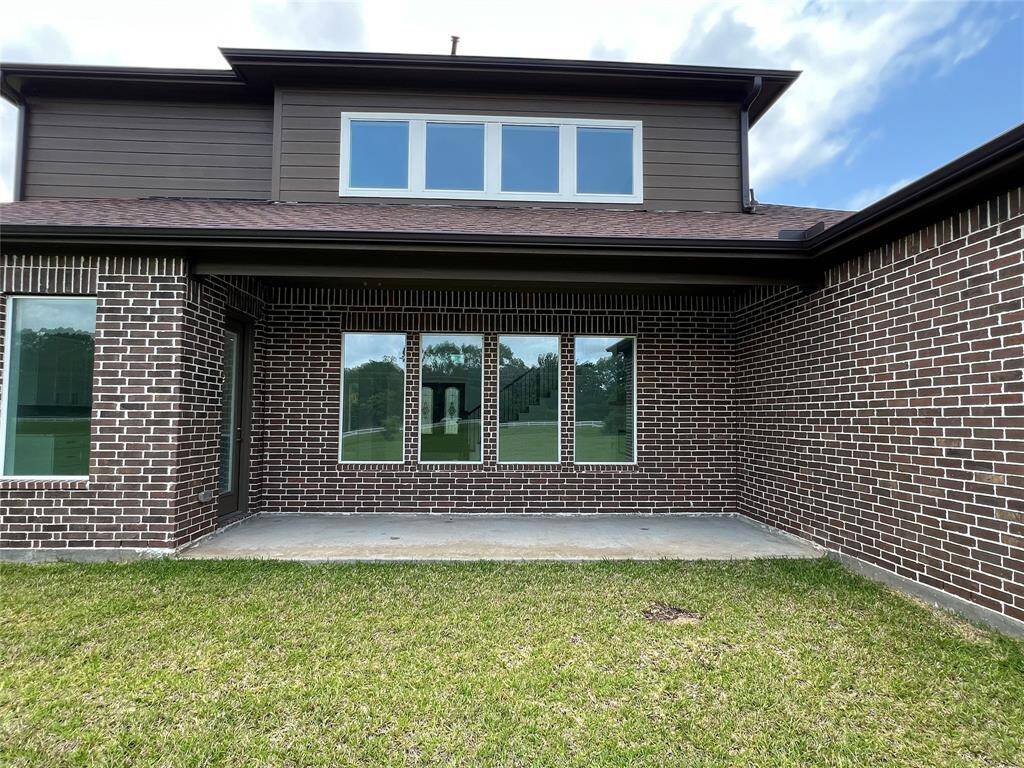 This back porch is waiting on you for countless days and evenings with family and friends.