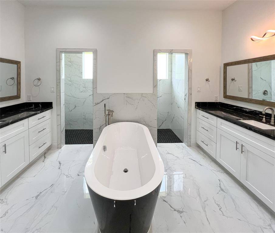 Primary bathroom making a statement with its free-standing tub.