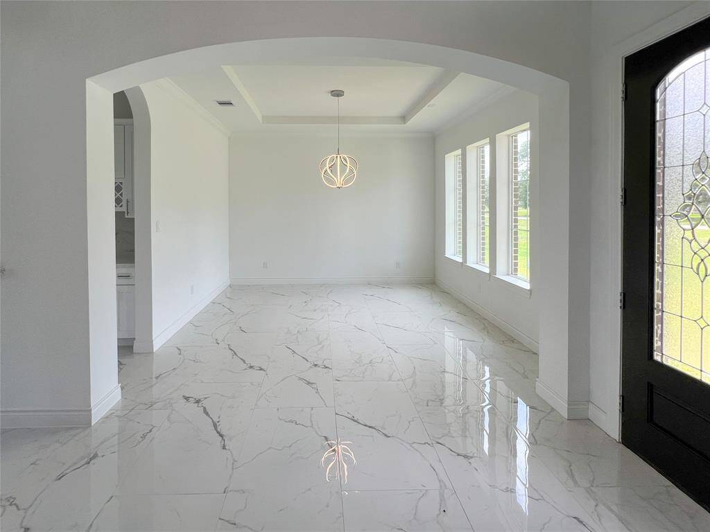 Dining area as you enter this costume stunning home.
