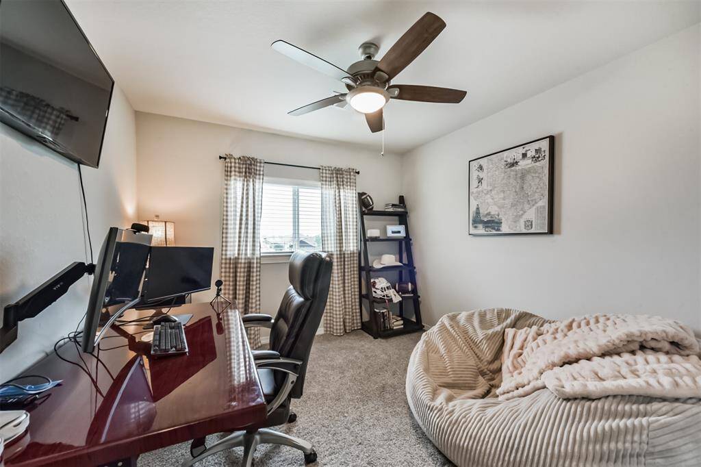 One of two secondary bedrooms being utilized as an office