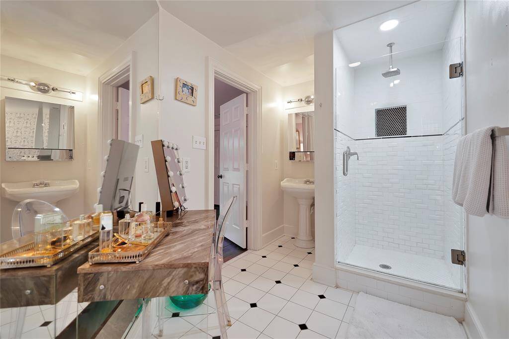 Updated shower, vanity, and light fixtures