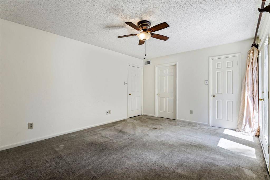 16x12 Primary Bedroom - Opposite wall shows two doors which open to the ensuite bathroom and walk-in closet.