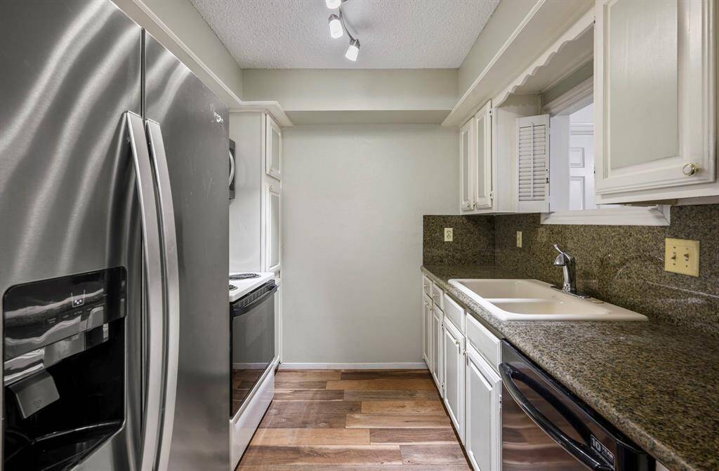 8x7 Kitchen - Granite counters and side by side refrigerator (included). Pass through over sink opens to living room.
