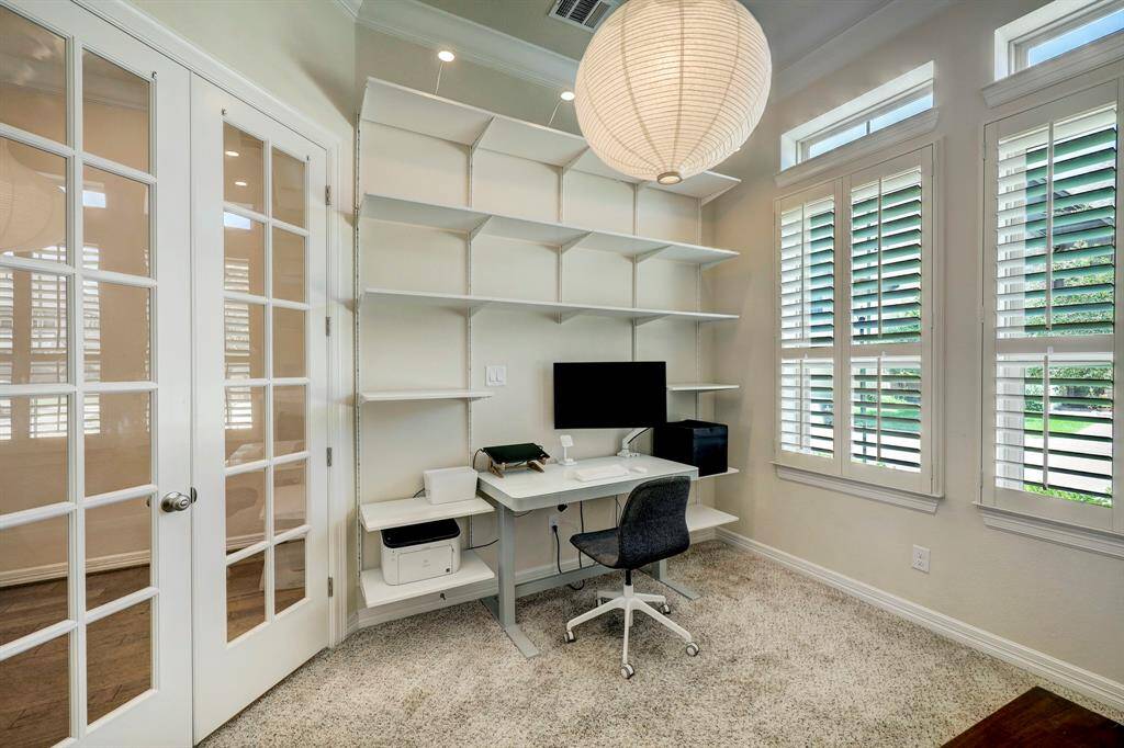 The study can easily be used as a guest bedroom as it offers an adjacent complete bath. It is beautifully enhanced with elegant private French doors and expansive windows, allowing an abundance of natural light to fill the space. This delightful feature not only illuminates the room but also provides a charming view of the front yard.