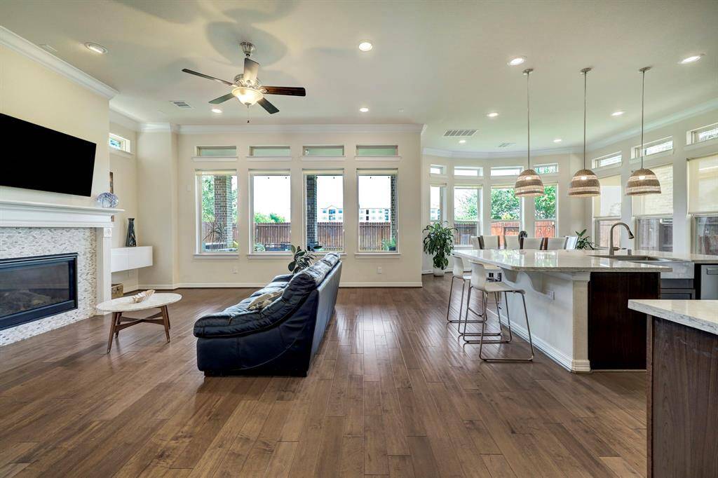 As you walk through the foyer, you will be warmly welcomed by the convenient open layout encompassing the family room, gourmet kitchen, and formal dining area.