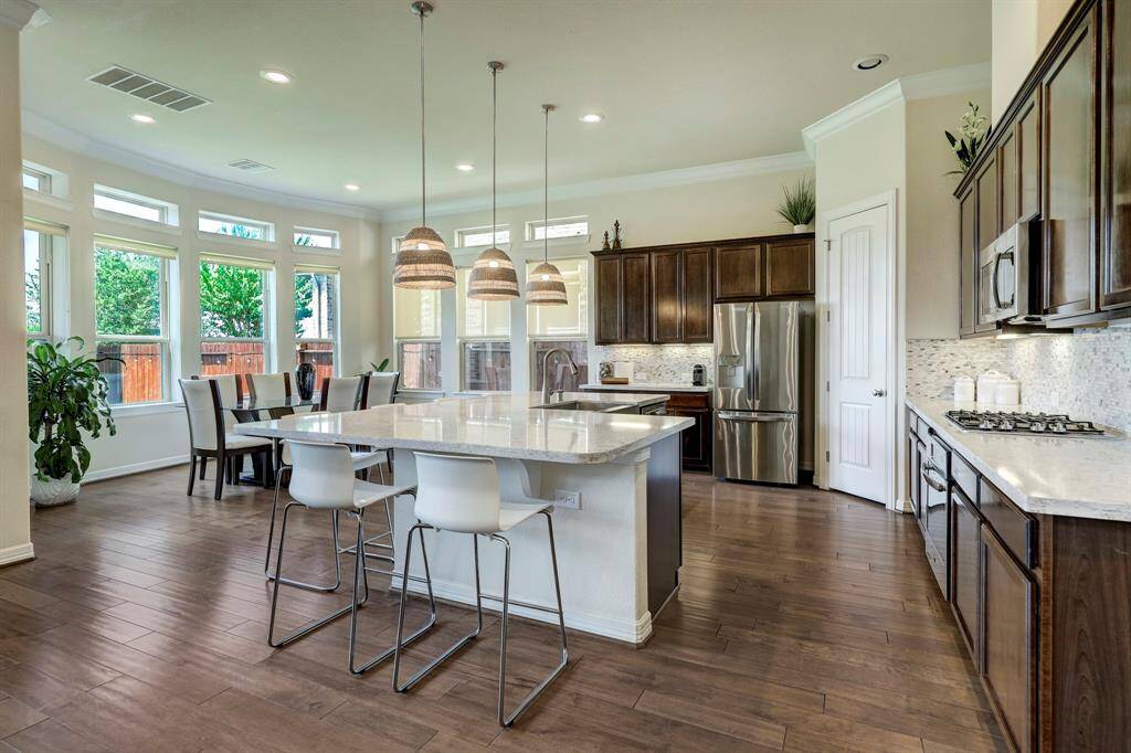 View of the gourmet Kitchen and formal Dining from the family room.