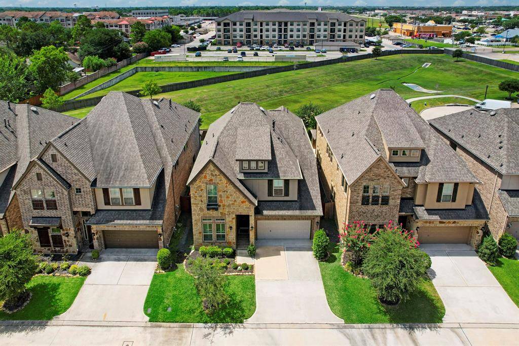 The breathtaking aerial view showcases the exceptional attribute of the property, boasting a desirable North-South exposure and an unobstructed backyard with no rear neighbors. Backing to a vacant lot owned by the community where families use as walking trails and kids love to explore....