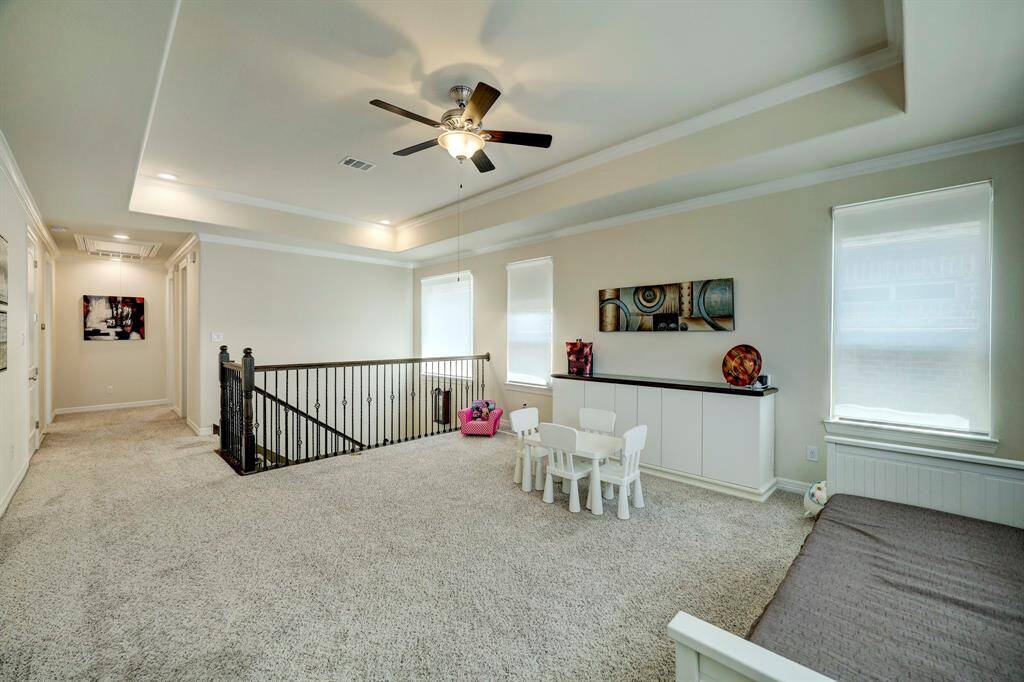 The second-floor landing provides access to the master bedroom and second bedrooms which are niched on the second level.