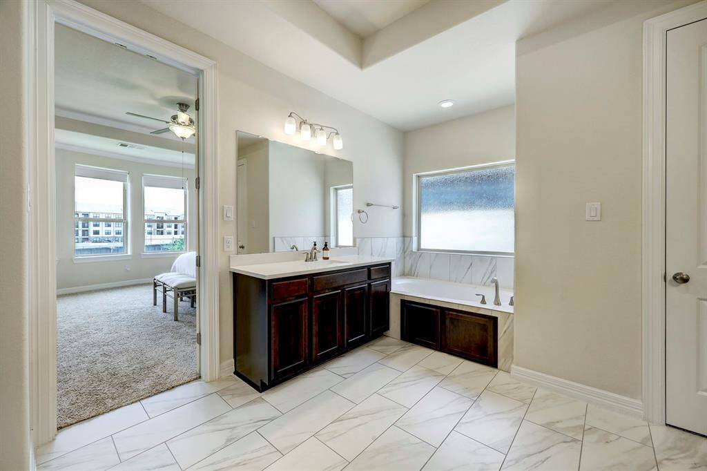 A soothing bathtub is just the perfect place to relax. Features a frosted window which creates a serene environment for relaxation.