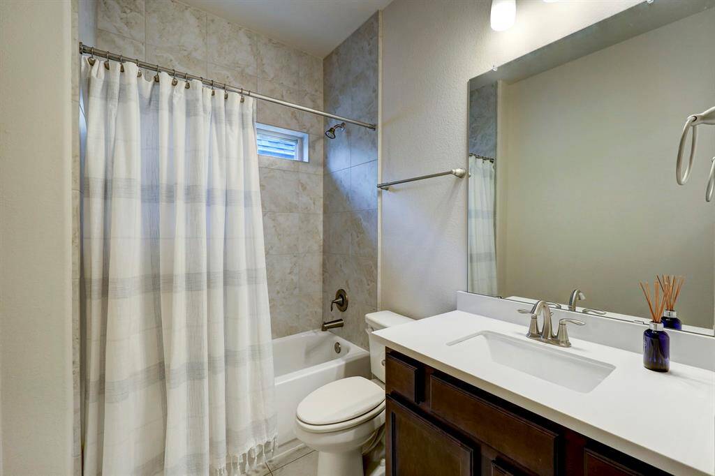 Secondary bedrooms share a common bathroom which is conveniently designed with a vanity, water closet, and shower/bath combination.