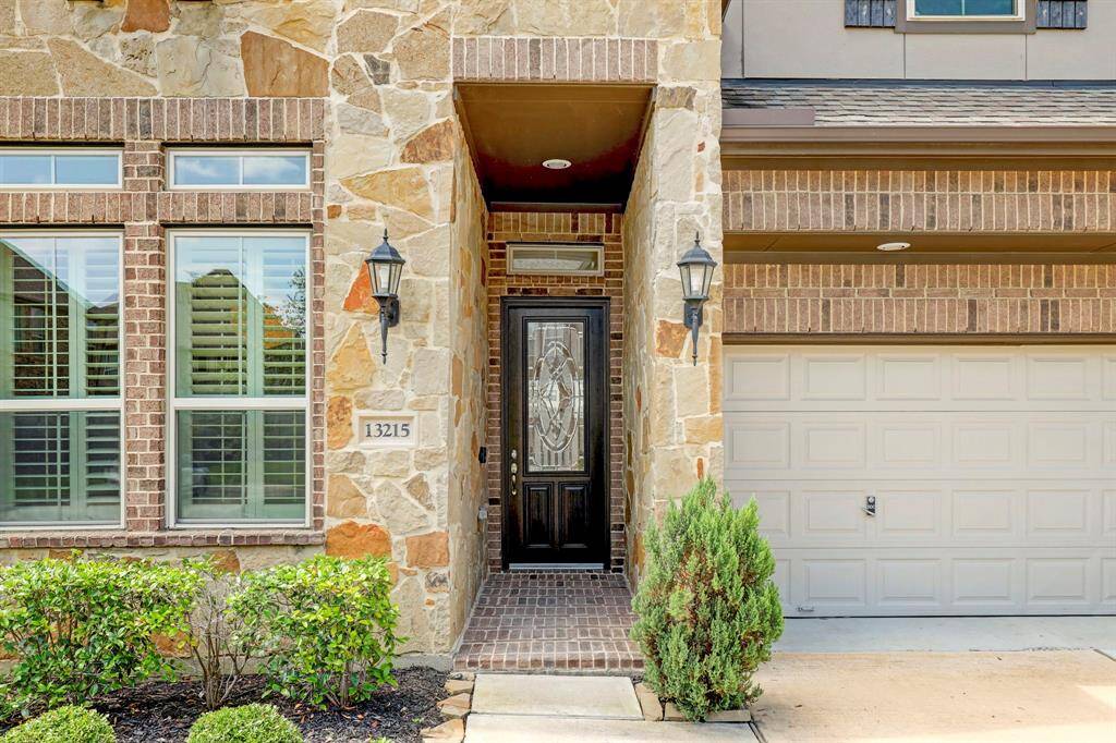 Prepare to be captivated by the stunning stone and brick design that adorns the exterior and vestibule of the property. As you approach the front door, you'll also appreciate the elegant wooden accents and lead glass elements that enhance the front facade.